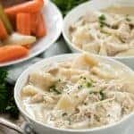 Two white bowls of Chicken and Dumplings