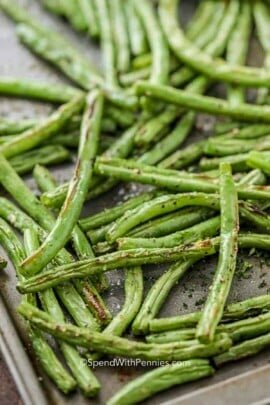 Roasted green beans on a baking sheet