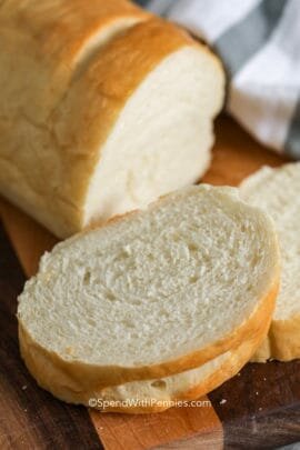 Slices of fresh French bread on a wooden board