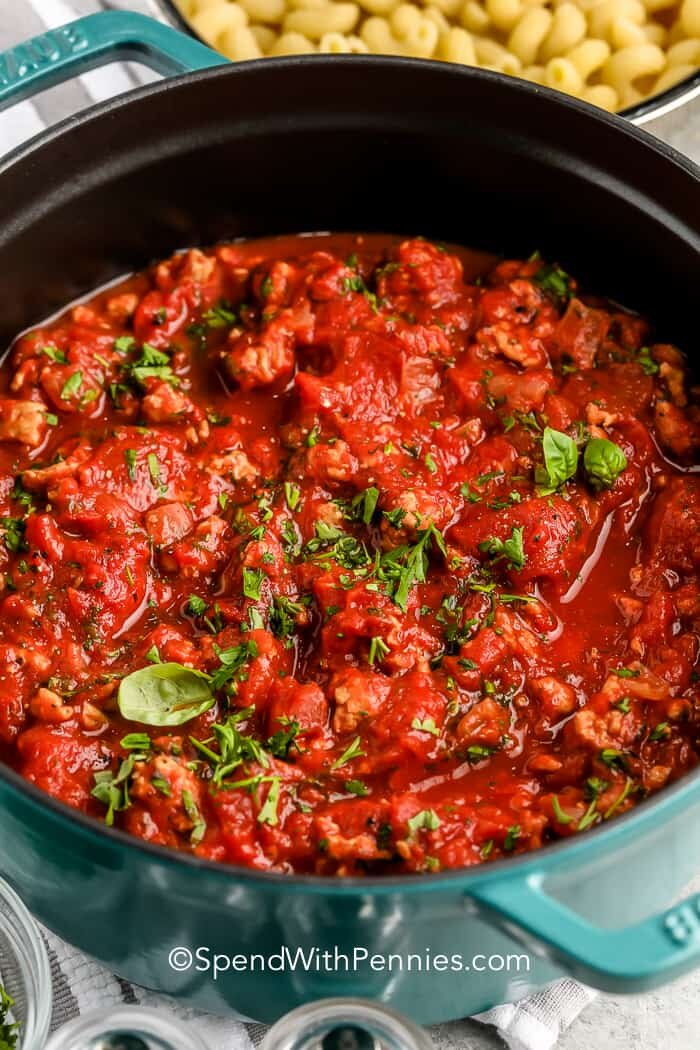 Turkey Spaghetti Sauce in a pot with basil and parsley