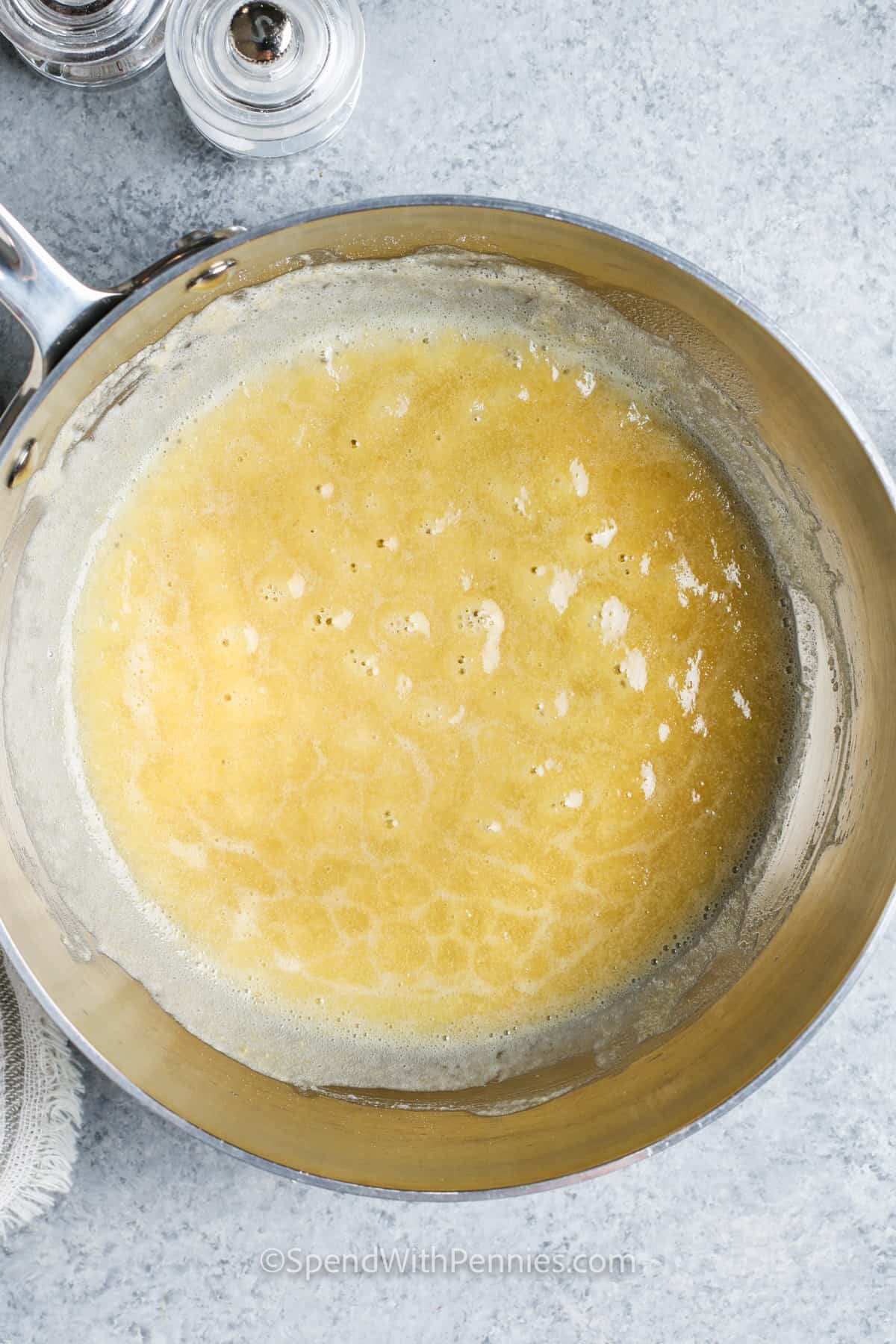 melting flour with butter to make roux for Baked Mac and Cheese