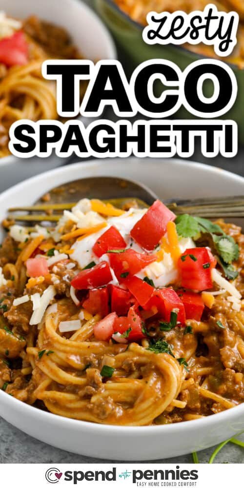 Taco Spaghetti with sour cream and tomatoes with writing