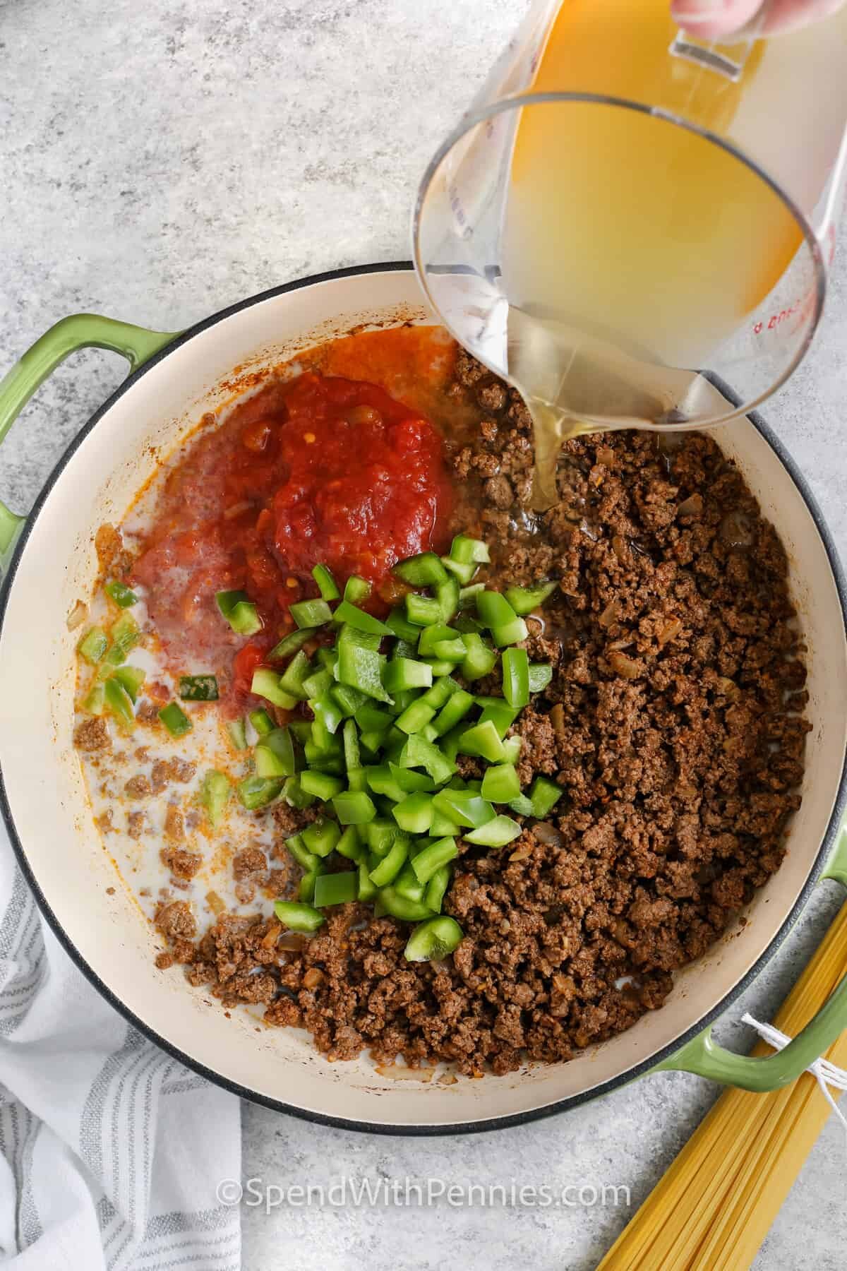 adding brother , salsa and peppers to pan to make Taco Spaghetti