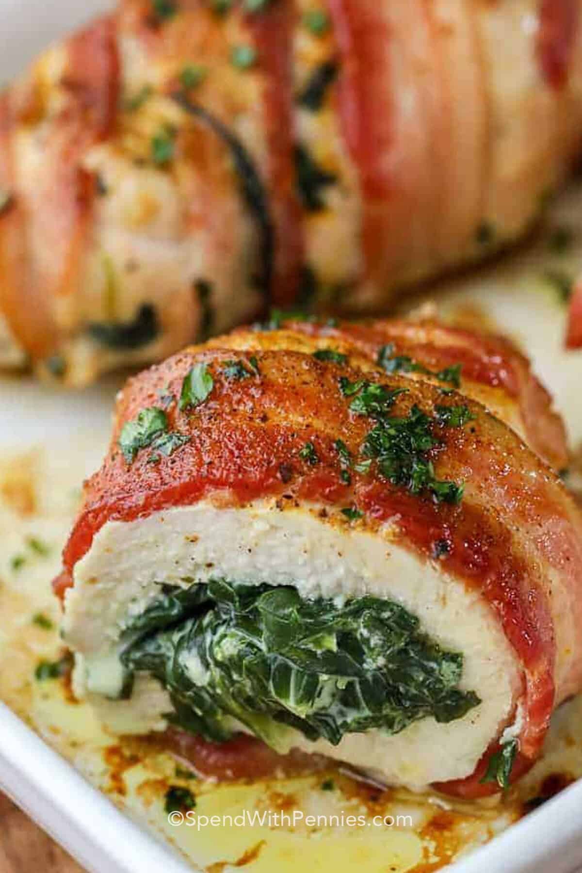 spinach stuffed chicken breasts in a dish